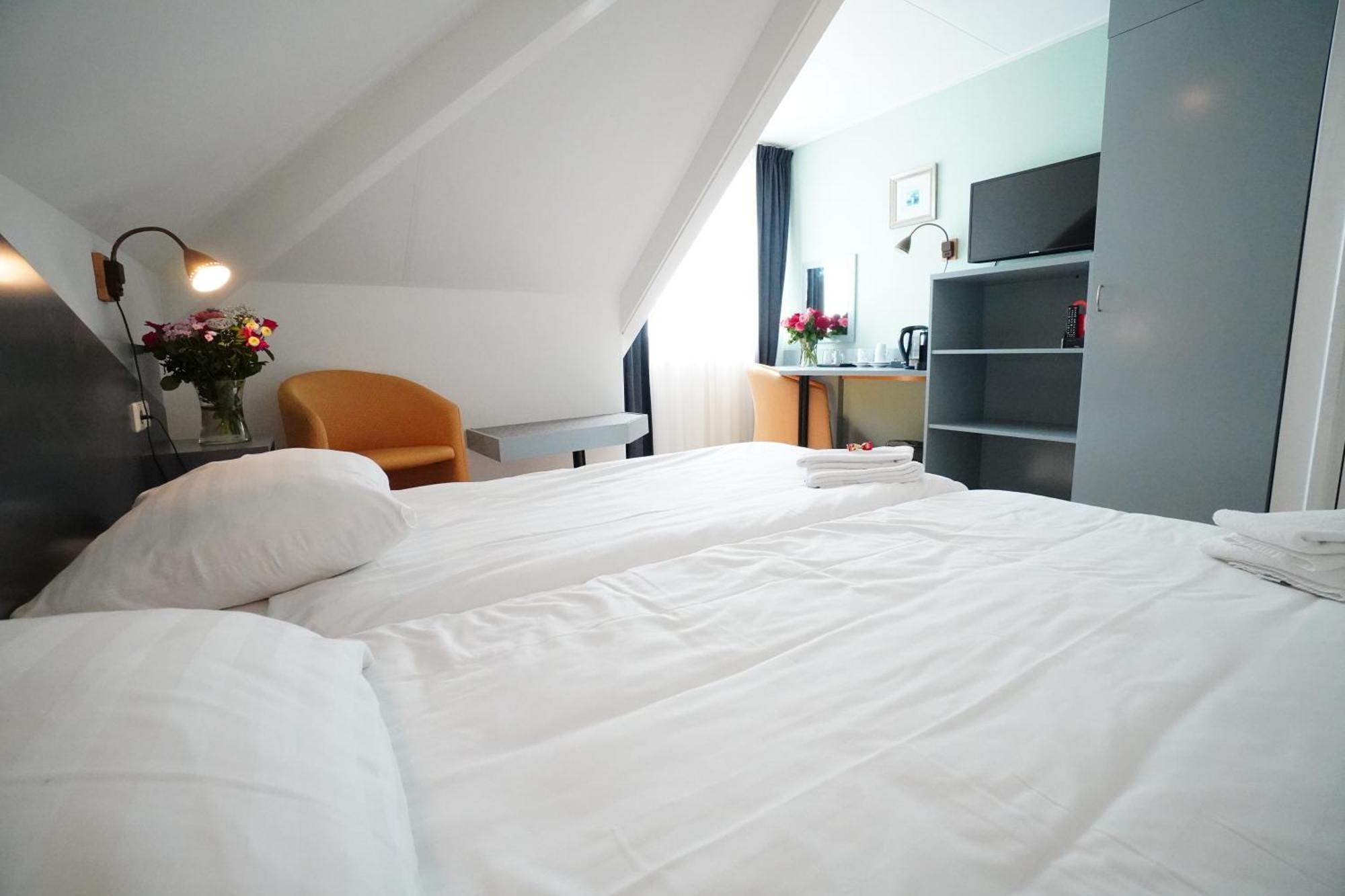 Hotel Den Burg Rum bild