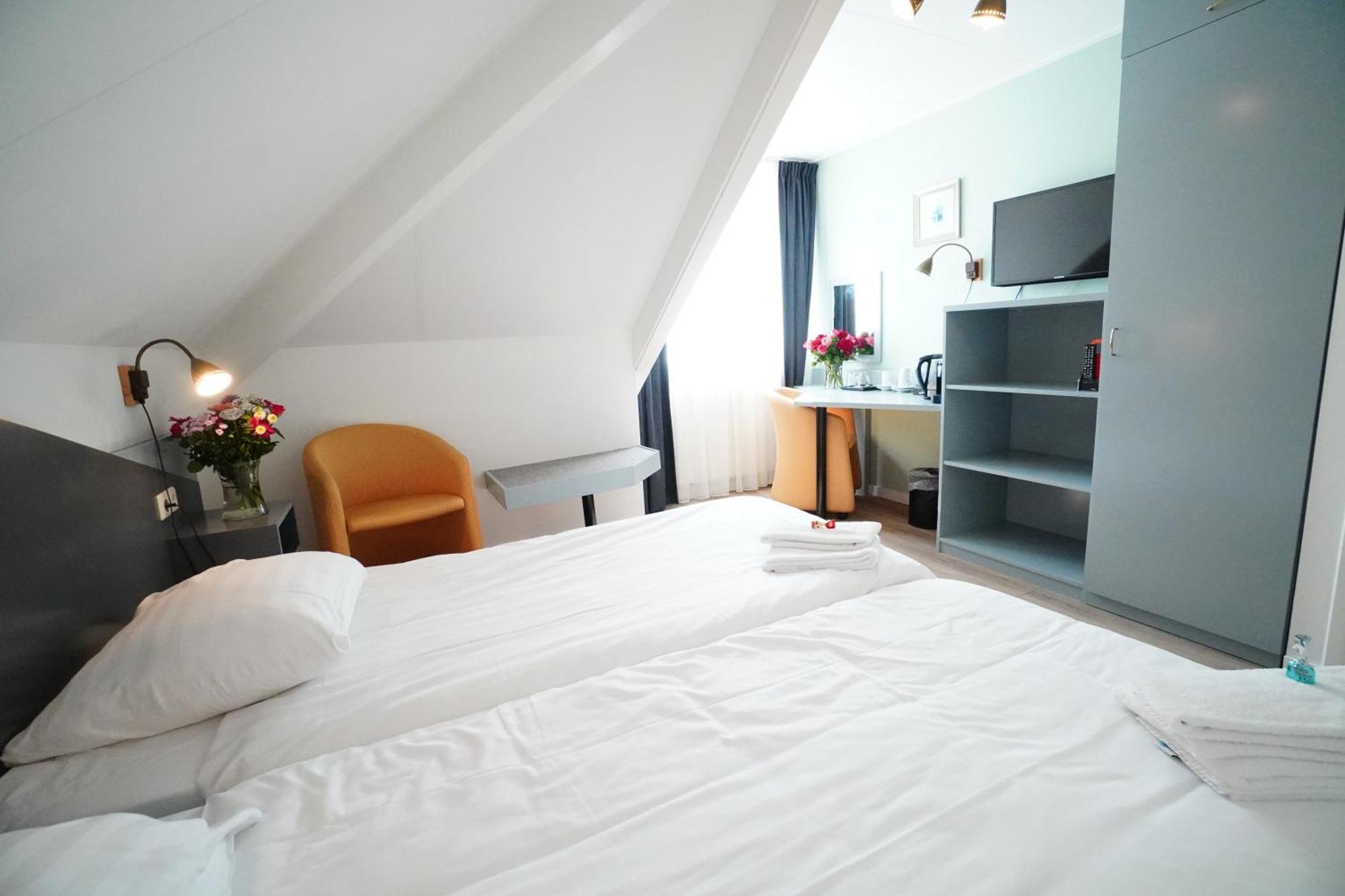 Hotel Den Burg Rum bild