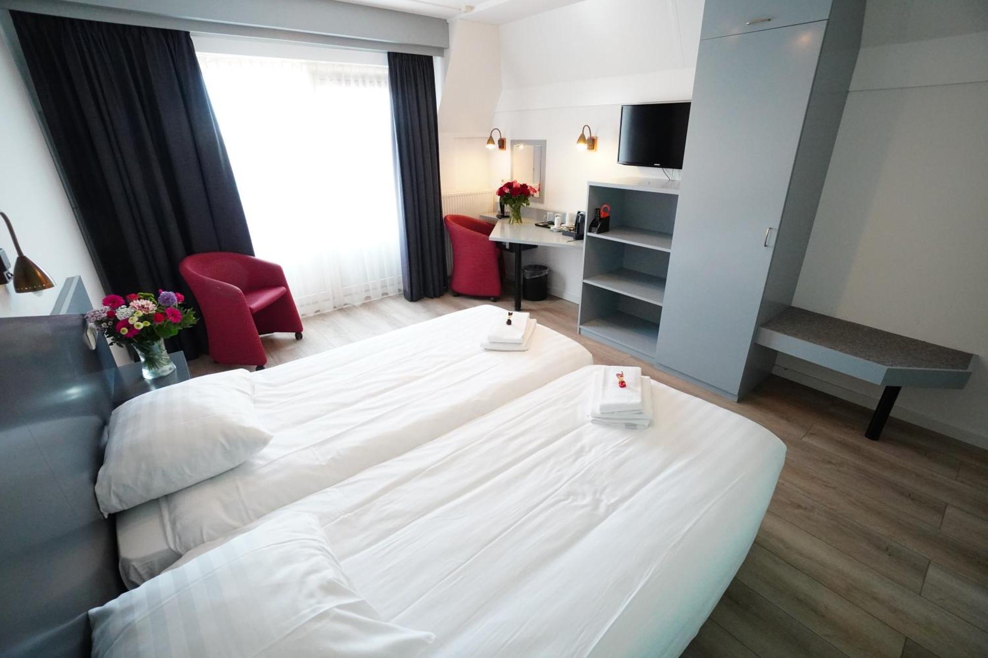 Hotel Den Burg Rum bild